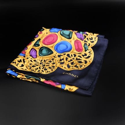 CHANEL 
Silk square scarf with a jewel-inspired pr
