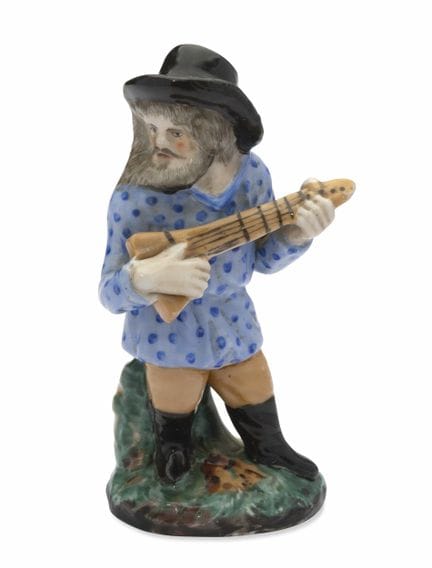 RUSSIAN PORCELAIN FIGURE OF A BALALAIKA PLAYER
Pri
