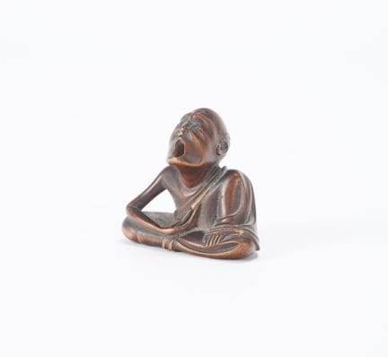 Japan, 19th century
Wooden netsuke depicting a com