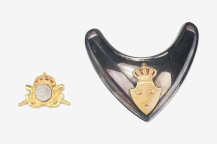 A Swedish officer's collar tab and a headgear insi
