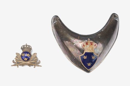 A Swedish officer's collar tab and a headgear insi