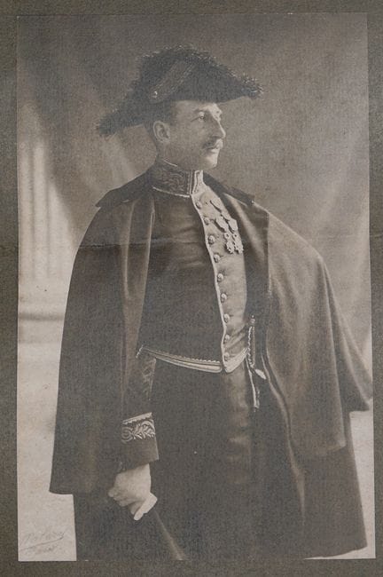Formal bicorne hat in black taupe felt, with a cur