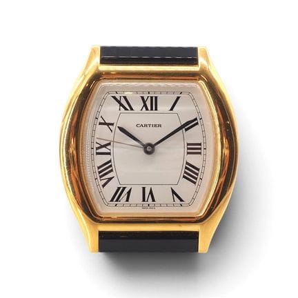 CARTIER
Quartz alarm clock. Gold-plated brass case