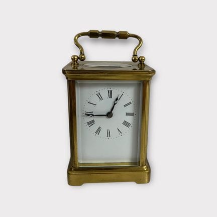 Pendulette d'officier en laiton doré dans son écri