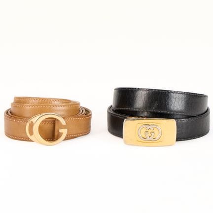 Gucci, Italy. Two Gucci belts, including: one reve