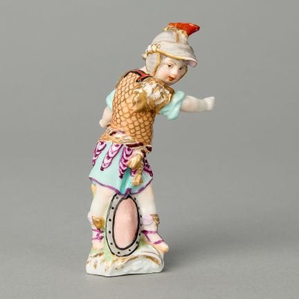 Kister, Germany. Porcelain figure of a cupid in di