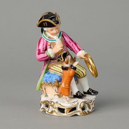 Royal Vienna, Austria. Porcelain figure of a seate