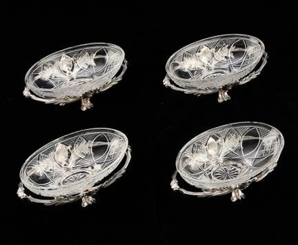 Christofle, France. Set of four cut glass oval dis