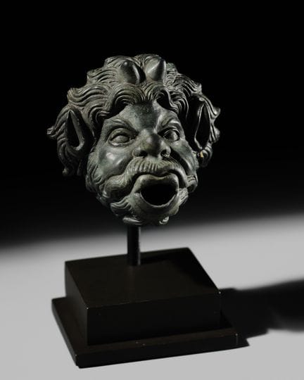 A ROMAN BRONZE WATER SPOUT DEPICTING PAN, PROBABLY