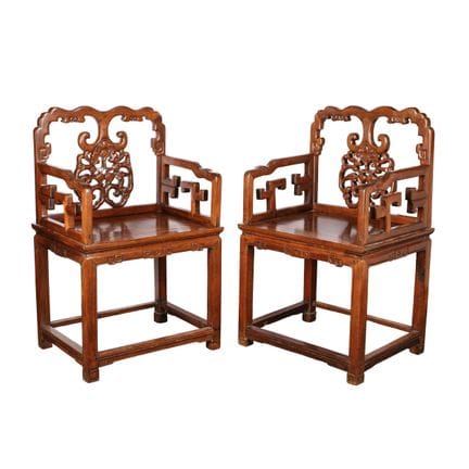 A pair of Chinese hongmu 'bat and peach' armchairs