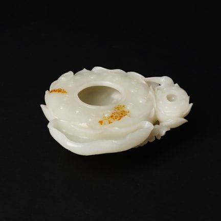 A large Chinese celadon 'lotus pod' jade group, 19