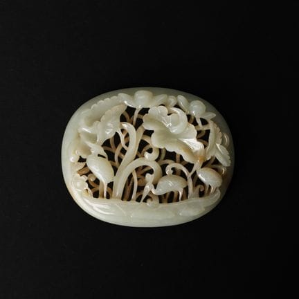 A Chinese celadon jade 'cranes and lotus' openwork