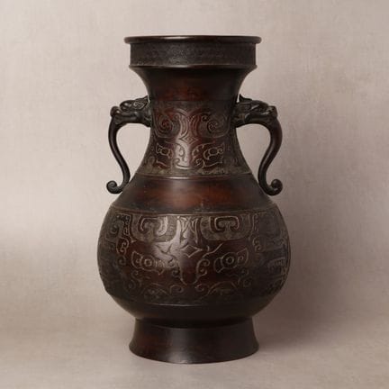 A Chinese archaistic bronze 'taotie' vase, hu, Qin