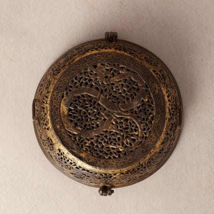 A rare Tibetan gilt-damascened iron bowl box and c