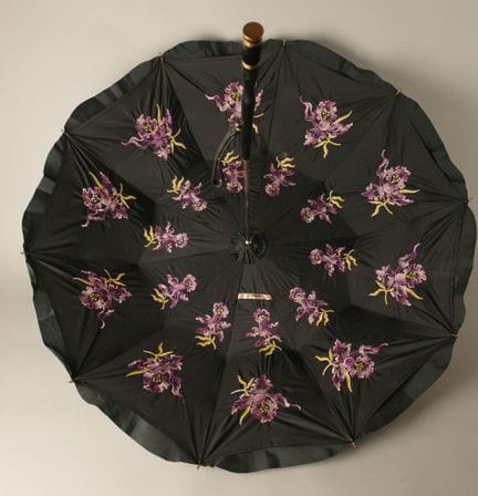 Black nylon parasol, with a black leather-covered 