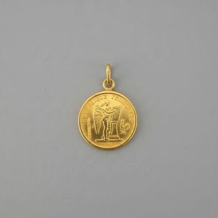 Yellow gold (.750) pendant featuring a 20-franc co