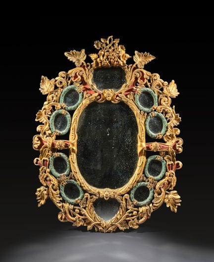 Grand miroir ovale à parecloses en bois sculpté, d