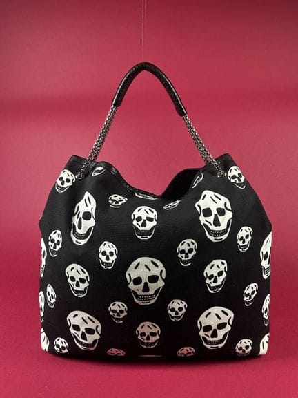 ALEXANDER McQUEEN 
Black canvas shoulder bag print