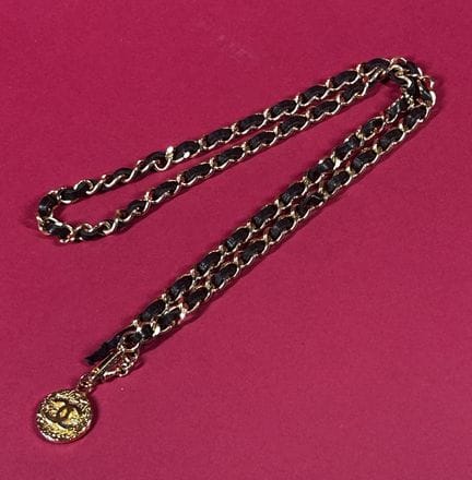 CHANEL, 1982
Gold-tone metal chain belt interwoven
