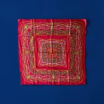 CHANEL 
Silk scarf featuring a jewelry-inspired pr