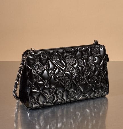 CHANEL 
Small black patent leather quilted bag emb
