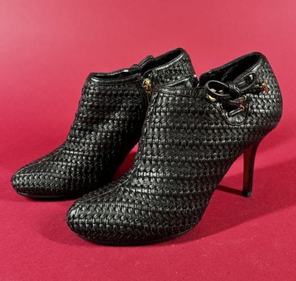 DIOR 
Pair of black braided leather low boots, wit