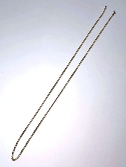 18K（750）金链，链节呈链节状。
鹰头印记
（曾受损，搭扣缺失。）
重量：7克；长度：55厘米（
