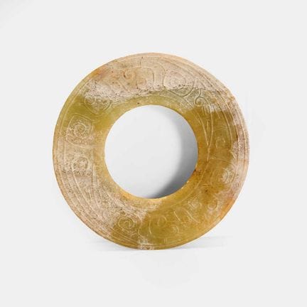 A Chinese jade bi disc, in the Han style, the broa