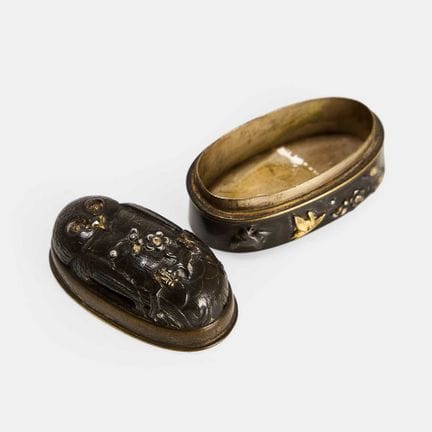 A Japanese shakudo snuffbox, 19th century, adapted