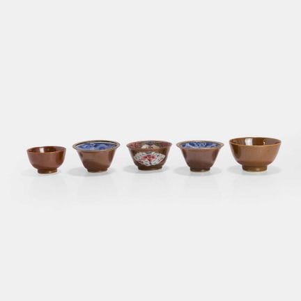 A group of five Chinese café-au-lait-glazed cups, 