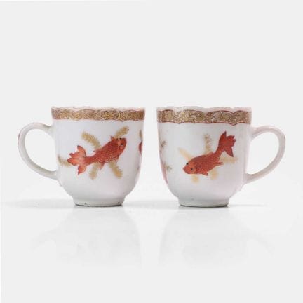 A pair of Chinese export iron-red-decorated teacup