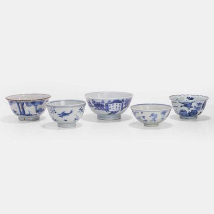 A collection of five Japanese blue and white bowls