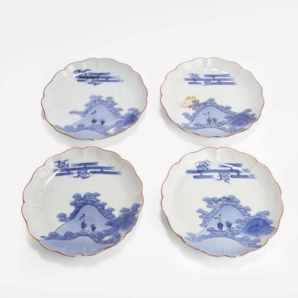 A group of four Japanese Arita blue and white dish