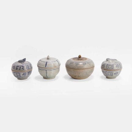 A collection of four Southeast Asian pottery boxes