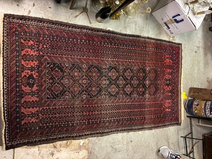 RUG with stylized floral and geometric designs on 