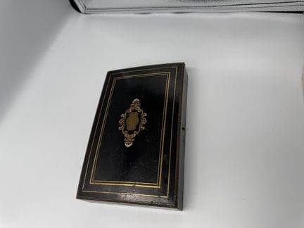 GAME BOX made of blackened wood and gilded brass, 