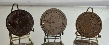 THREE MEDALLIONS—two in terracotta and one enamele