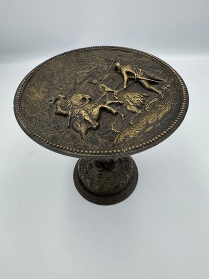SAUCER on a metal pedestal, decorated with a bas-r