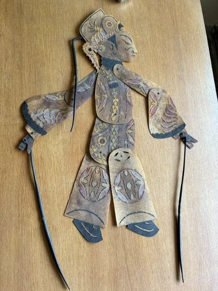 Perforated leather shadow puppet depicting a chara