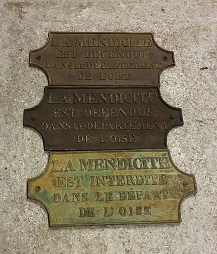 THREE CAST-IRON PLAQUES with bas-relief depictions