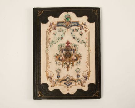 Cartonnier en cuir vert à décor au petit fer, la c