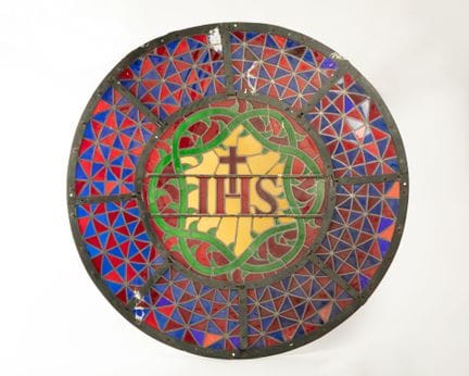 Rosace en vitrail, verres et plomb, motif central 