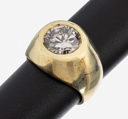 Bague en or 14 carats sertie d'un brillant, poinço