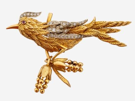 Broche en or 18 carats sertie de diamants et de ru