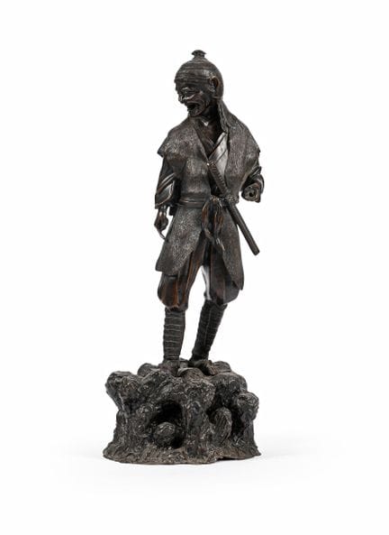 A Japanese cast bronze figure of an Ainu ManLate M
