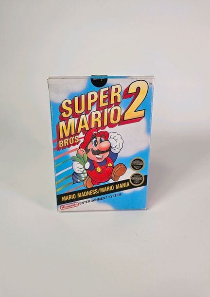任天堂 - NES。游戏：《超级马里奥兄弟2》。含原装盒、说明书和游戏卡带。 《马里奥狂热》。PAL