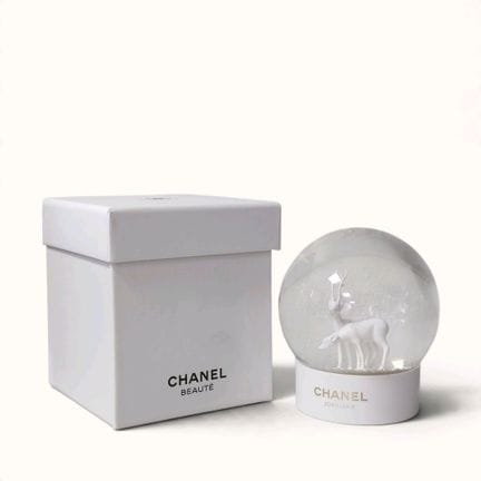 CHANEL. Snow globe with gold glitter featuring a s