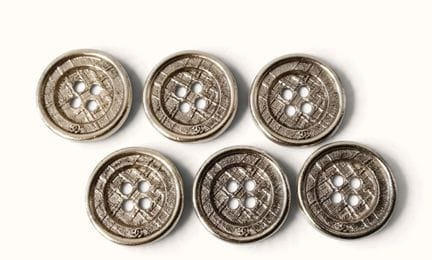 CHANEL. Set of six round, silver plated metal butt
