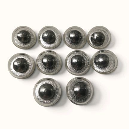 CHANEL. Set of 10 decorative spherical buttons wit