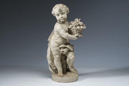 A composite stone garden sculpture depicting a put
